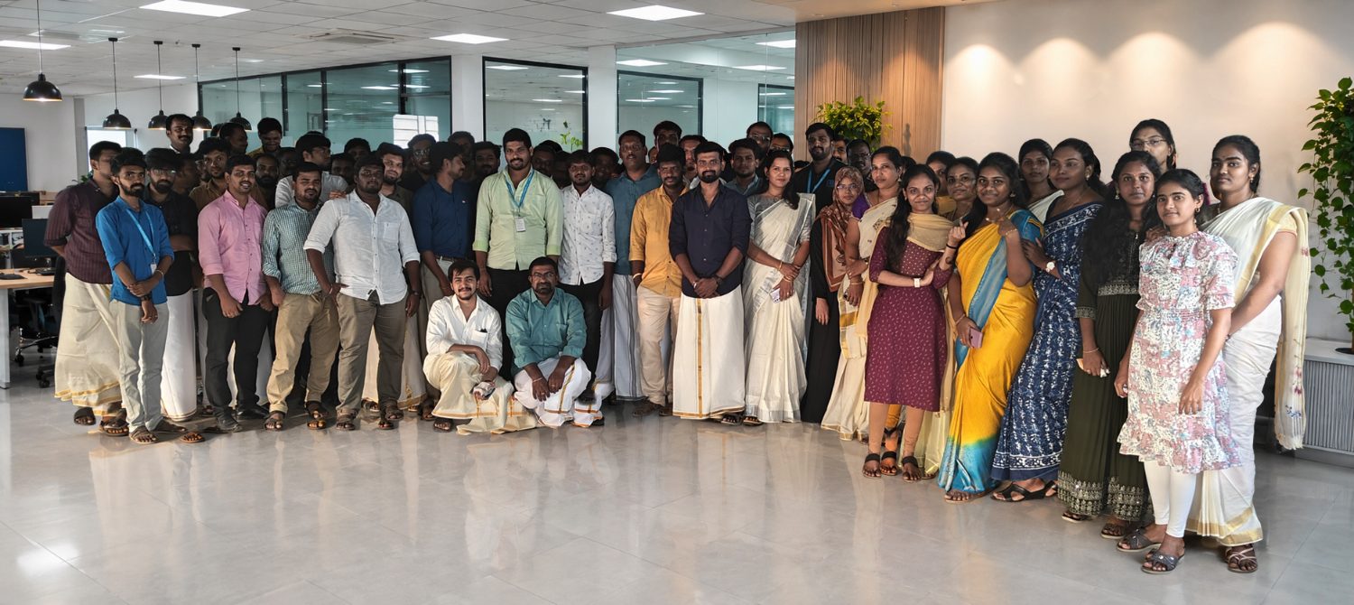 The Creatrix Campus team gathered on the office floor in traditional dress for a festival day