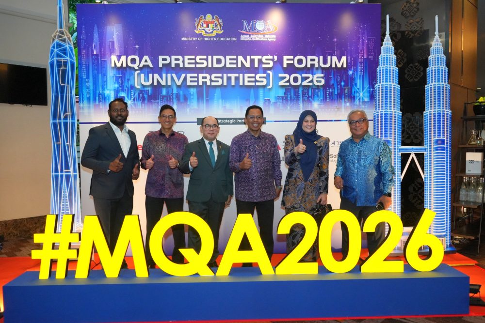 Creatrix Campus team with Malaysian higher education leaders at the MQA Presidents' Forum (Universities) 2026 backdrop